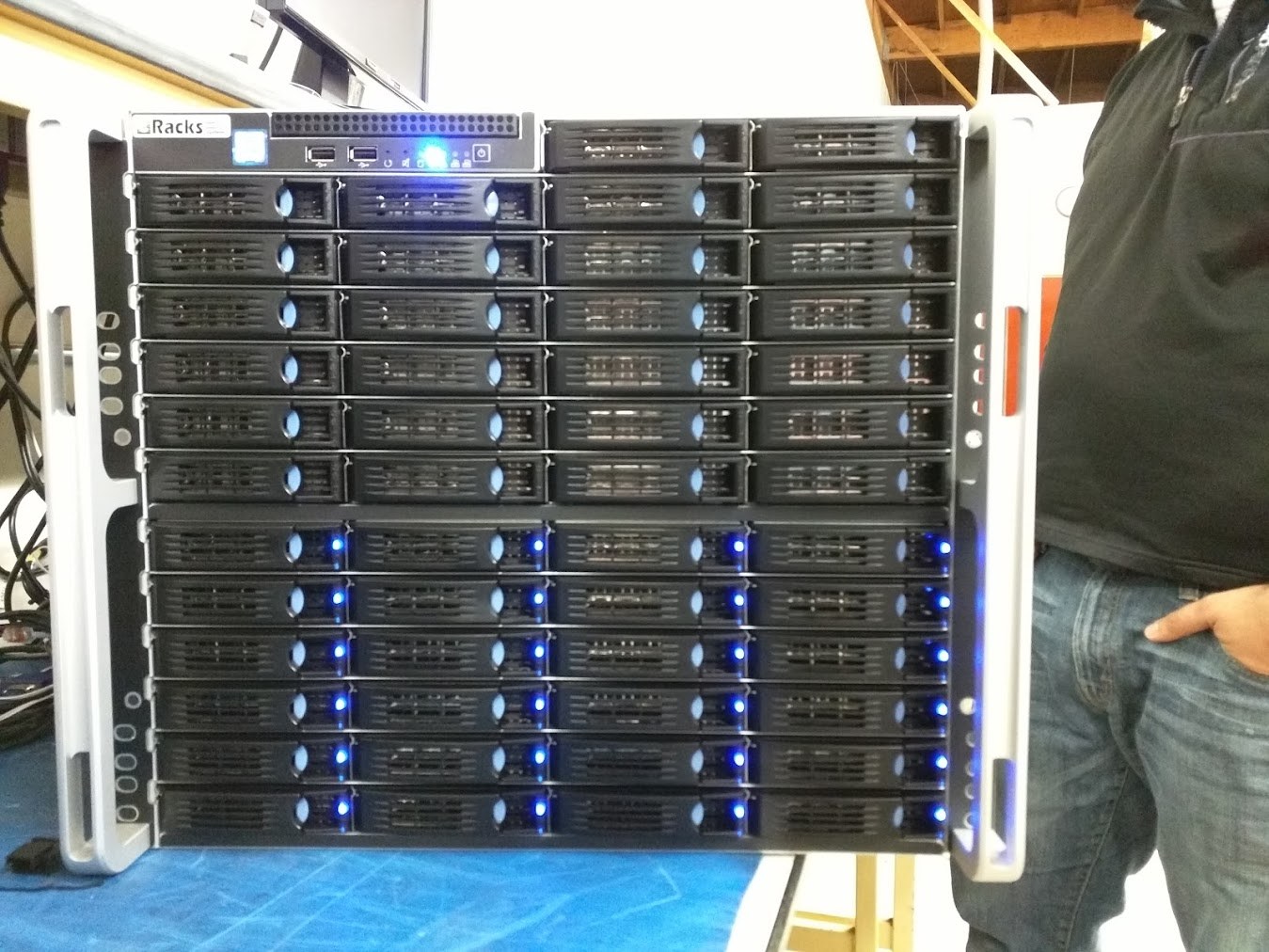 A 36-bay eRacks storage server on the bench, drive LEDs lit